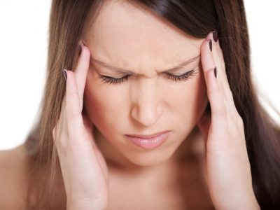 young woman with migraine