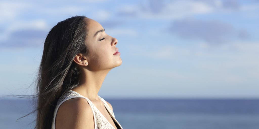 woman breathing fresh air