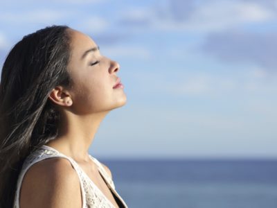 woman breathing fresh air